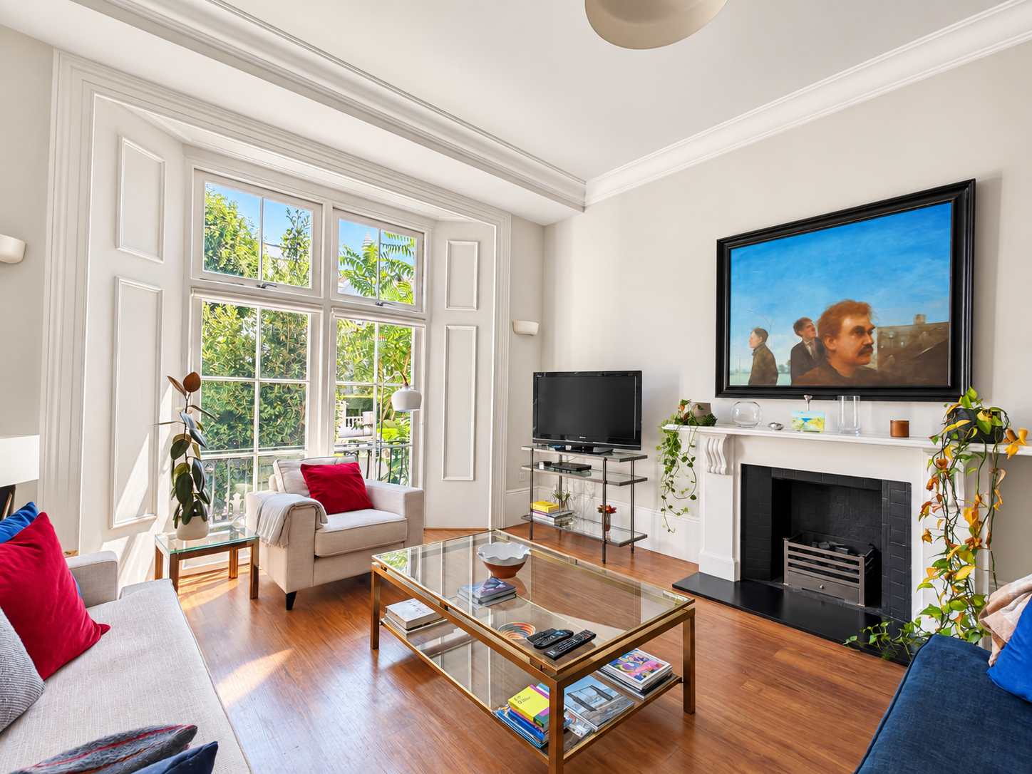 Sunlit reception room with large sash windows at Pembridge Villas, W11